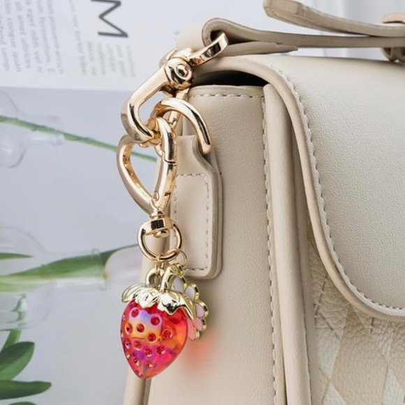 Strawberry bag charm with daisy and heart gold clasp approximately 3.5 inches - Picture 2 of 3
